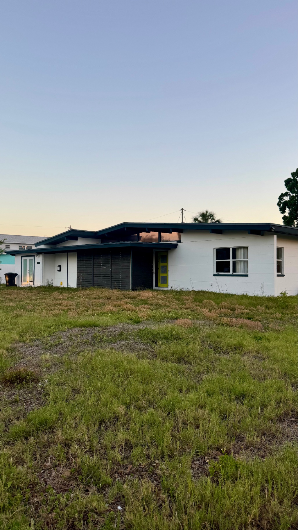 Midcentury modern home at 4830 Chancellor St NE at dusk